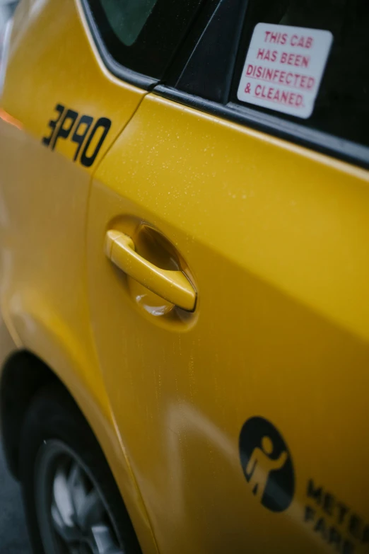 a yellow taxi cab parked on the side of the road, by Sven Erixson, unsplash, photorealism, close - up profile, shot on gopro9, square, “gas station photography