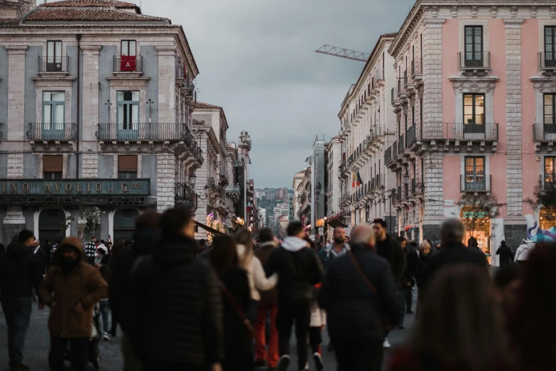 a crowd of people walking down a street next to tall buildings, a photo, by Alessandro Allori, pexels contest winner, renaissance, sicilian, slight overcast lighting, on a great neoclassical square, blonde