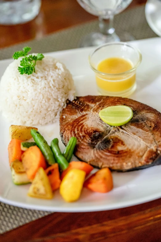 a close up of a plate of food on a table, by Robbie Trevino, dau-al-set, philippines, butterflyfish, rice, square