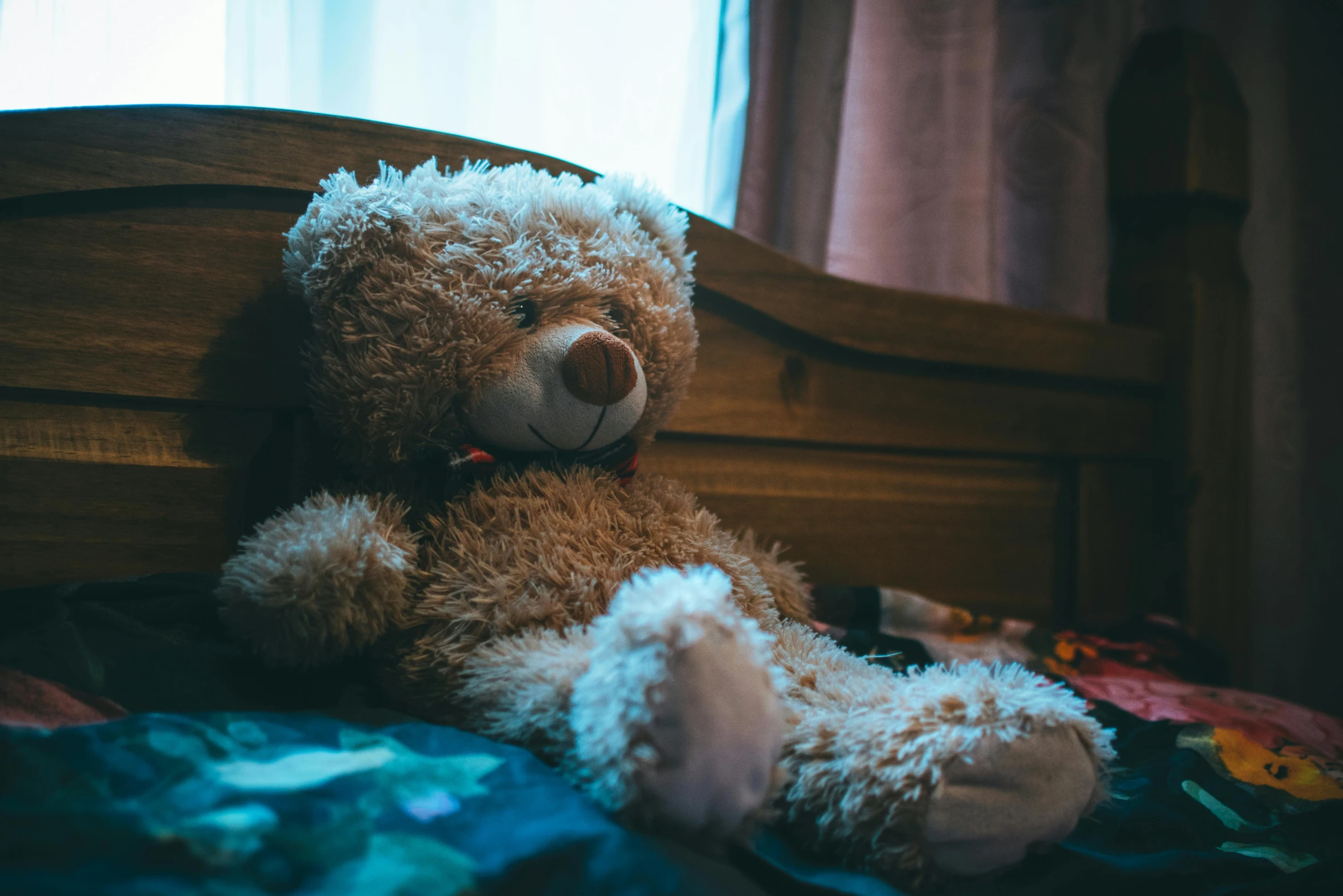 a brown teddy bear sitting on top of a bed, a cartoon, by Elsa Bleda, pexels, underexposed, childhood friend, lo fi, cuddling