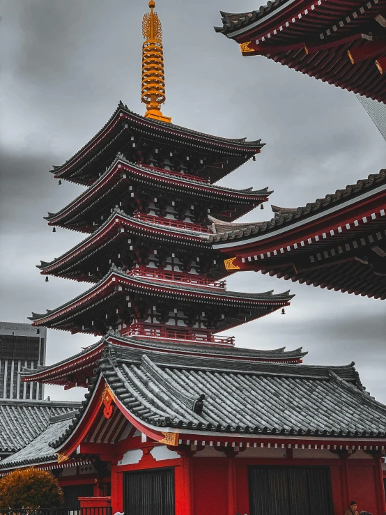 a tall pagoda sitting next to a tall building, inspired by Itō Jakuchū, pexels contest winner, crimson and grey color scheme, today\'s featured photograph 4k, high detail photograph, grey