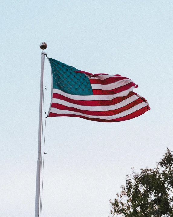 a large american flag flying on top of a flag pole, an album cover, unsplash, instagram story, profile image, 🚿🗝📝, reddit post