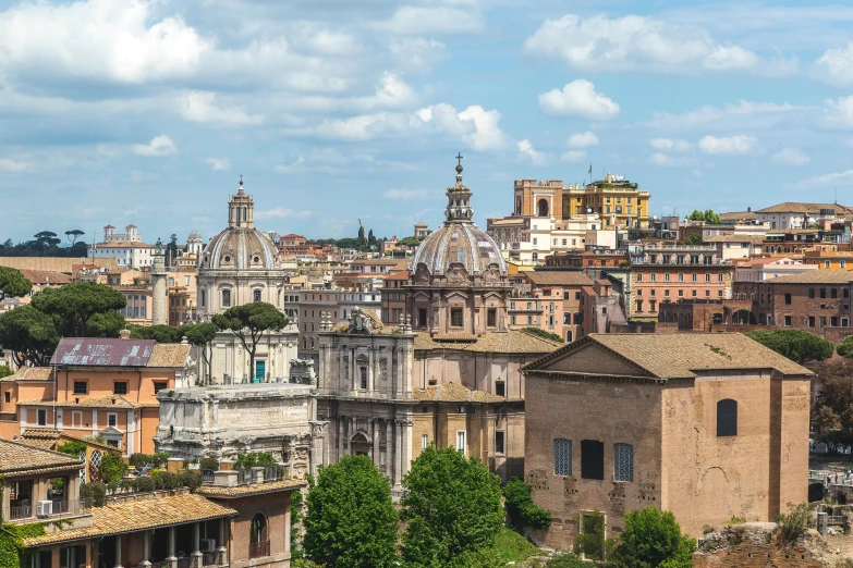 a view of a city from the top of a hill, pexels contest winner, neoclassicism, market in ancient rome, black domes and spires, on a bright day, slide show