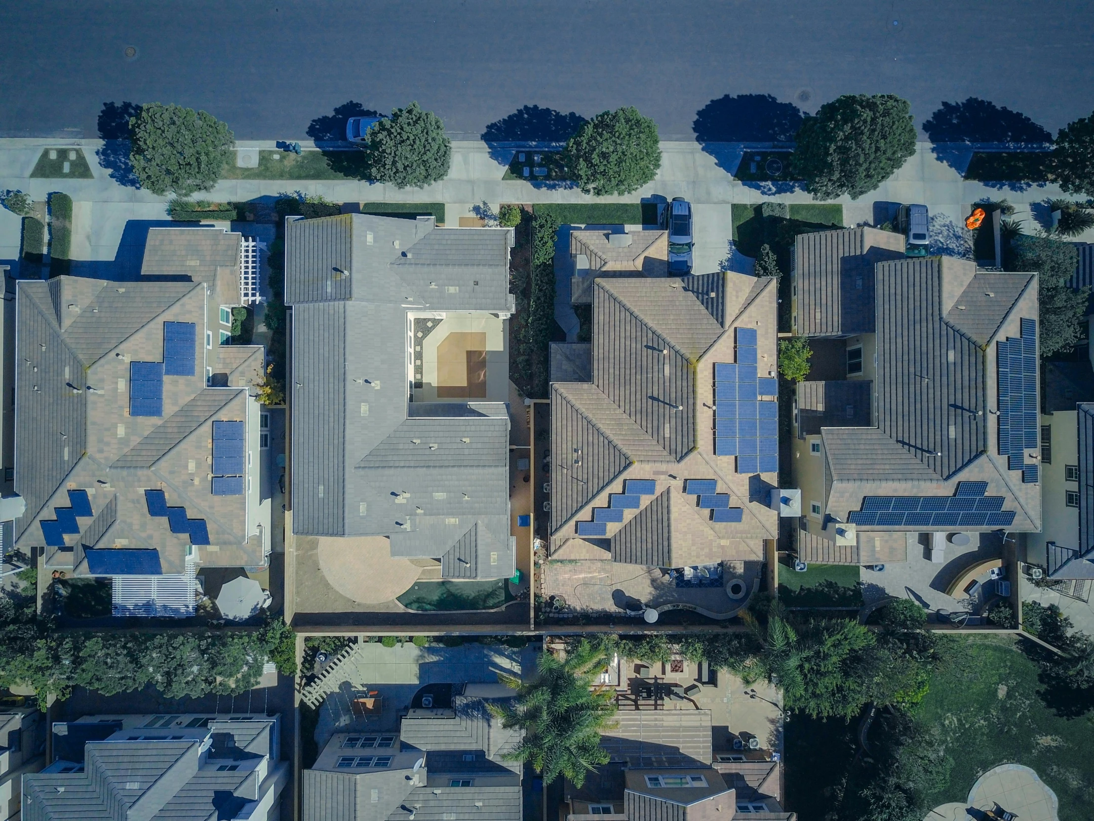 a bird's eye view of a residential neighborhood, a portrait, by Ryan Pancoast, pexels contest winner, solar panels, multiple wide angles, full device, low angle shot