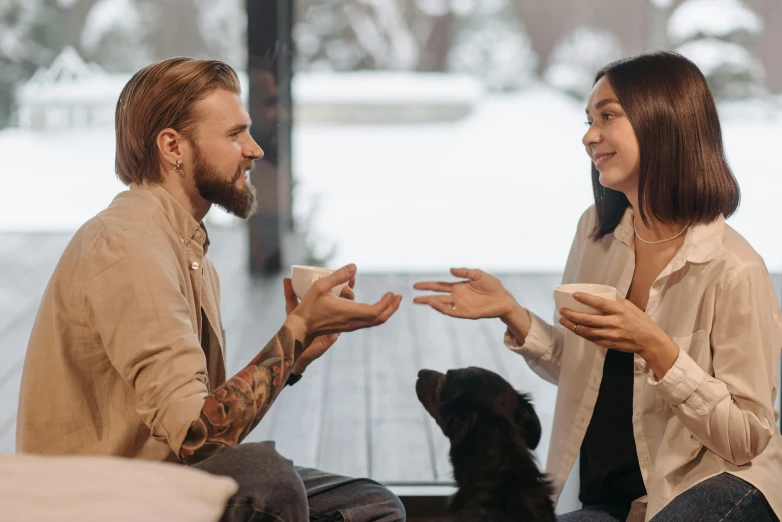 a man and woman sitting on the floor with a dog, two cups of coffee, reaching out to each other, lachlan bailey, mental health