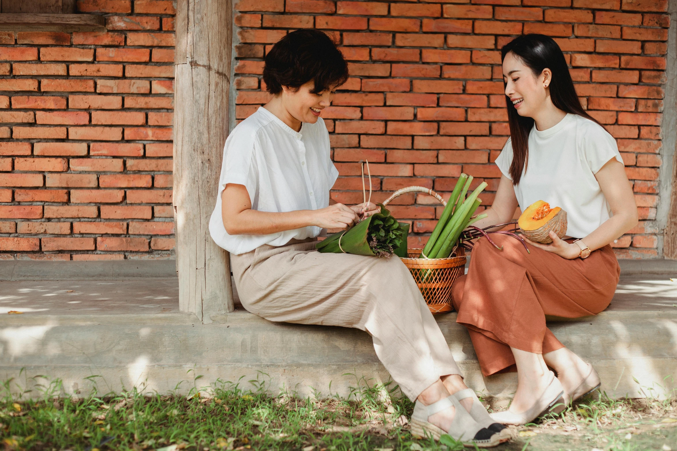 a couple of women sitting next to each other, pexels contest winner, a fruit basket, avatar image, asian female, gardening