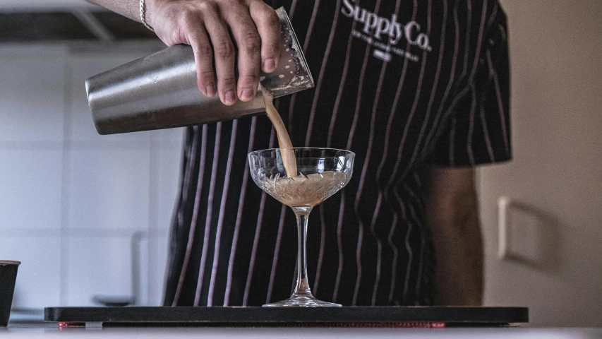 a person pouring a drink into a glass, inspired by Carlo Martini, superres sharpening, casey cooke, crushed quality, sydney hanson