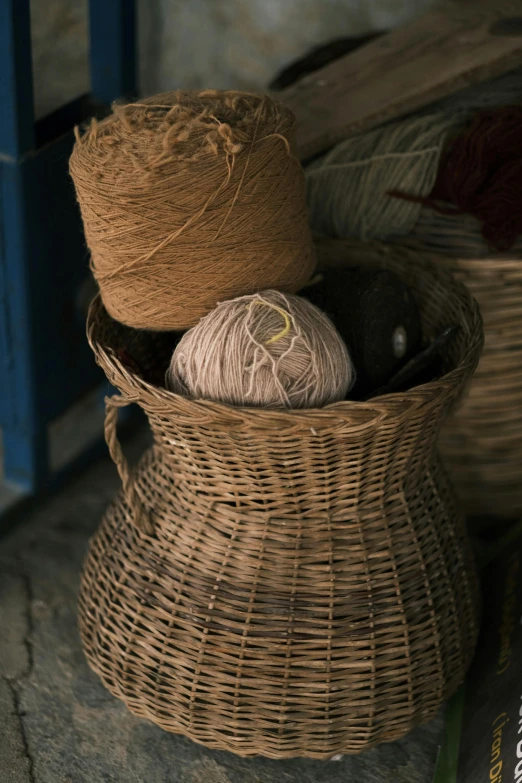 a basket that has some yarn in it, myanmar, muted brown, environment, asset