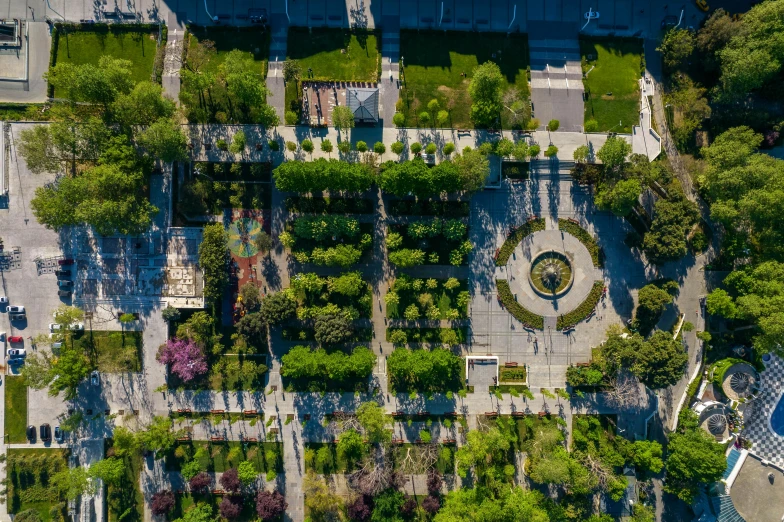 an aerial view of a park with lots of trees, by Dan Content, pexels contest winner, renaissance, sunken square, montreal, with a french garden, streetscapes