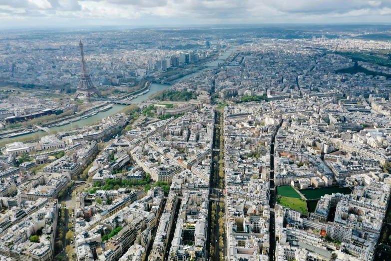 the view of paris from the top of the eiffel tower, an album cover, by Bernard D’Andrea, pexels contest winner, aerial view of a city, dezeen, helicopter footage over city, high-resolution photograph