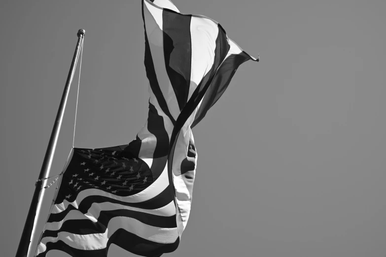 a black and white photo of an american flag, unsplash, currents, 15081959 21121991 01012000 4k, various posed, low angle photo