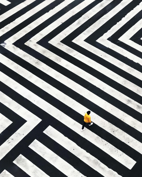 a yellow fire hydrant sitting in the middle of a crosswalk, an album cover, by Yasushi Sugiyama, unsplash contest winner, postminimalism, dazzle camouflage!!, ffffound, maze, lonely human walking