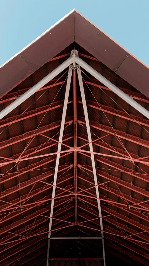 the roof of a building with a clock on it, an album cover, unsplash, modernism, red trusses, high detail photo, brown, hi-res