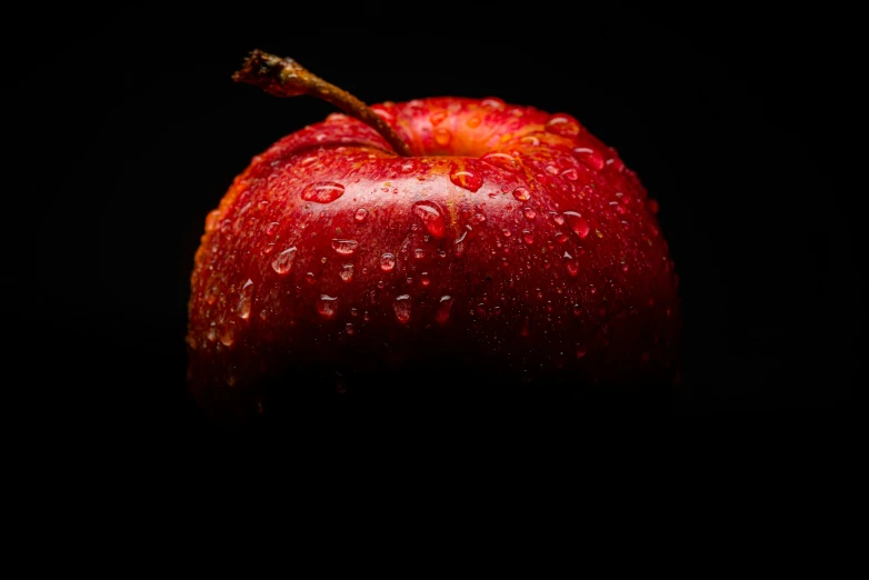 a red apple with water droplets on it, by Adam Marczyński, pexels, art photography, high resolution print :1 red, shot at dark with studio lights, portrait of a big, brown