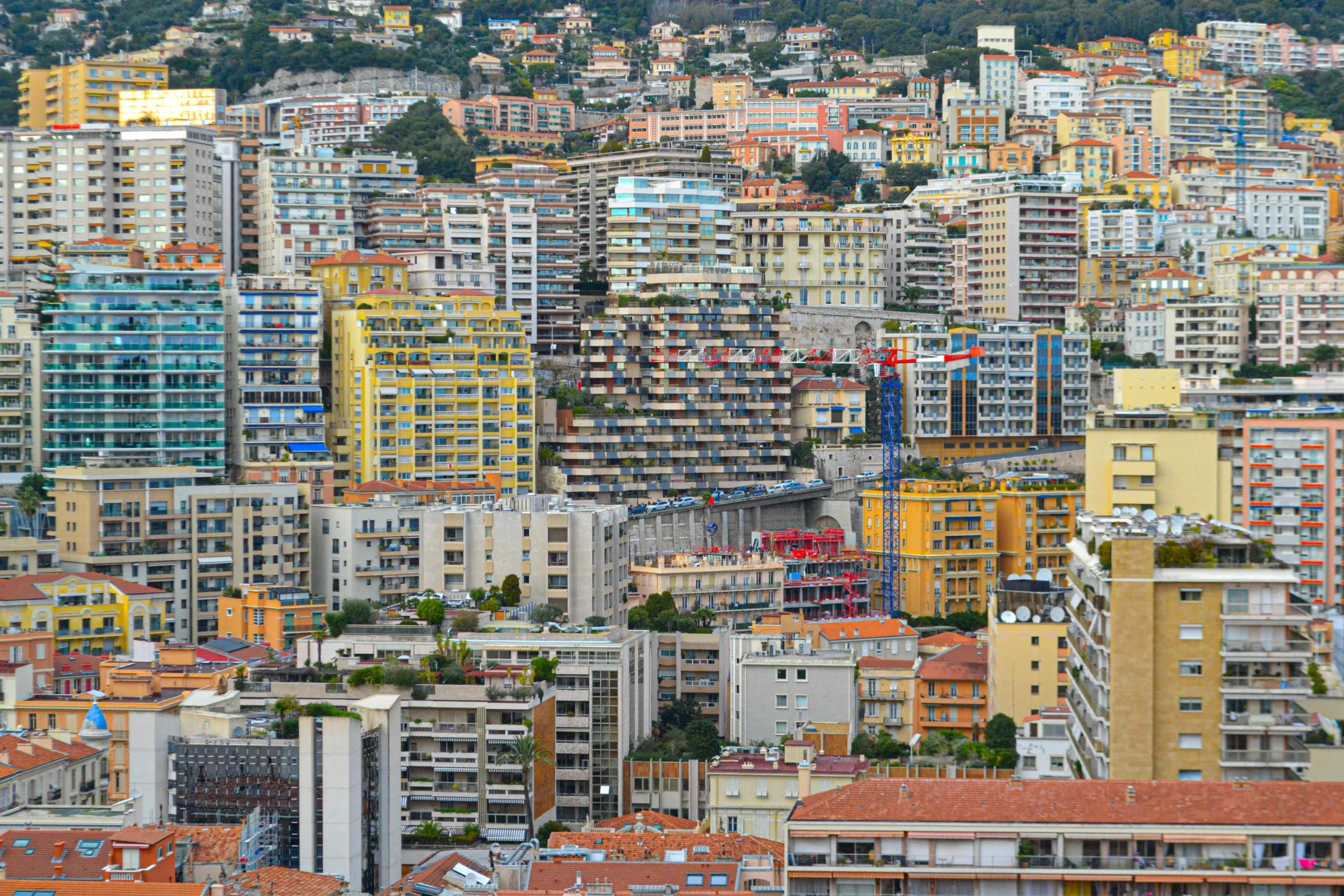 a city filled with lots of tall buildings, pexels, renaissance, hillside, hyperdetailed colourful, le corbusier, seaside