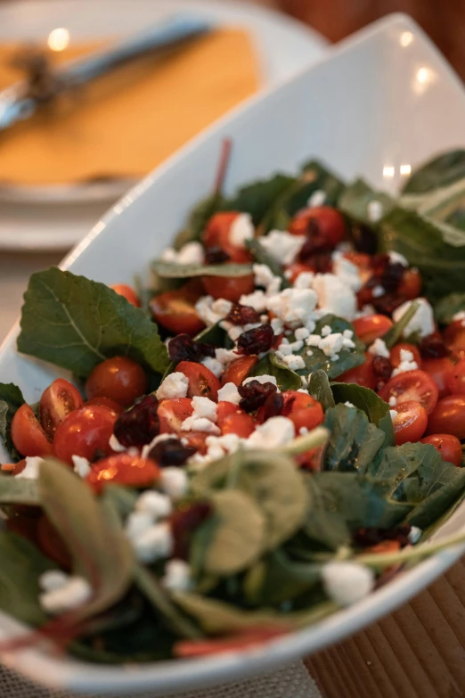 a close up of a plate of food on a table, salad, square, bowl filled with food, food