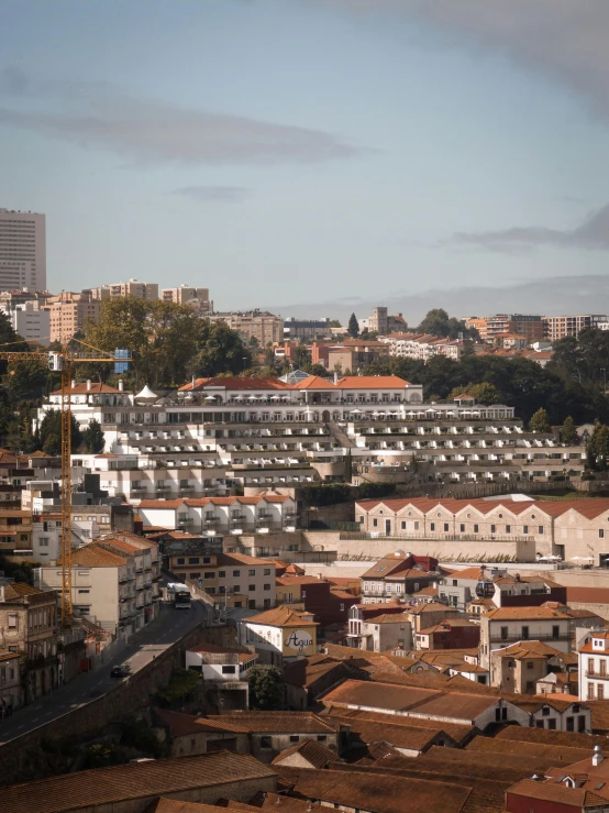 a view of a city from the top of a hill, inspired by Almada Negreiros, slide show, julia hetta, mass housing, low quality photo