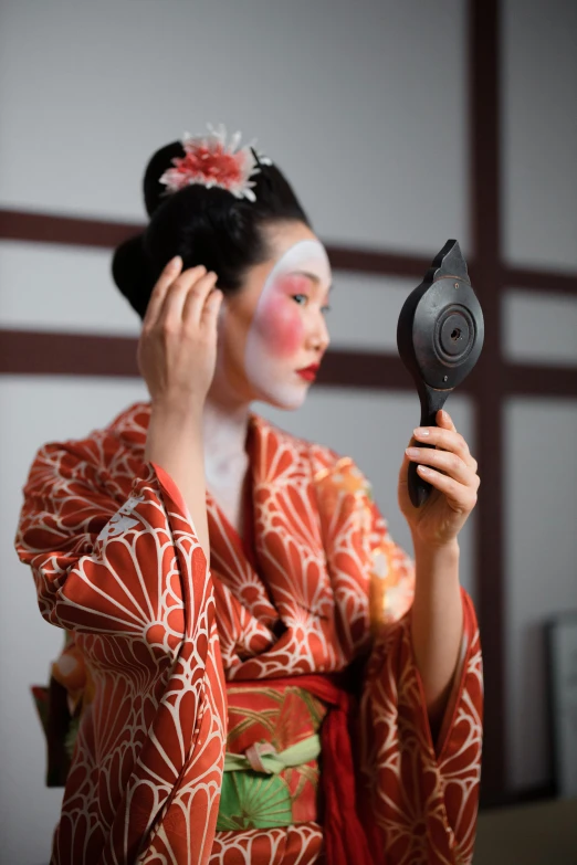 a woman that is standing in front of a mirror, inspired by Tosa Mitsunobu, trending on unsplash, ukiyo-e, with professional makeup, fujifilm”, square, concert