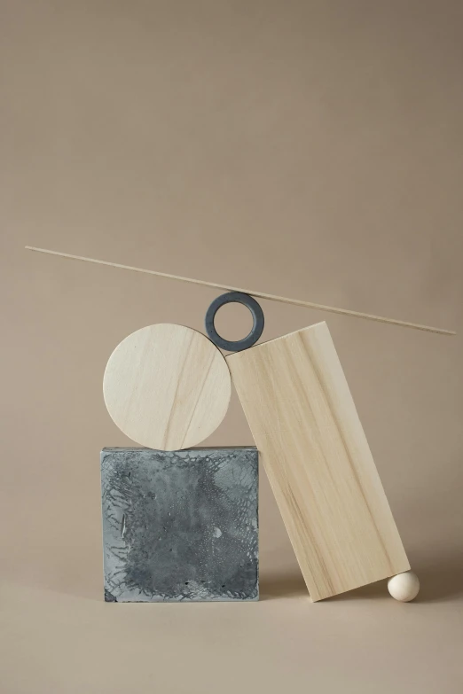 a wooden block sitting on top of a cement block, an abstract sculpture, by Harvey Quaytman, kinetic art, ilustration, circle, jovana rikalo, balance rendered