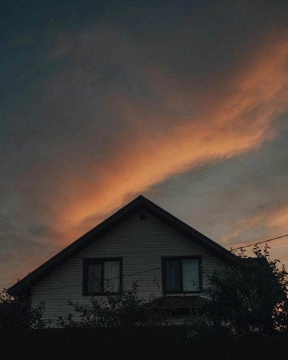 a house with a sunset in the background, pexels contest winner, aestheticism, cotton candy clouds, ominous lighting, looking up onto the sky, low quality photo