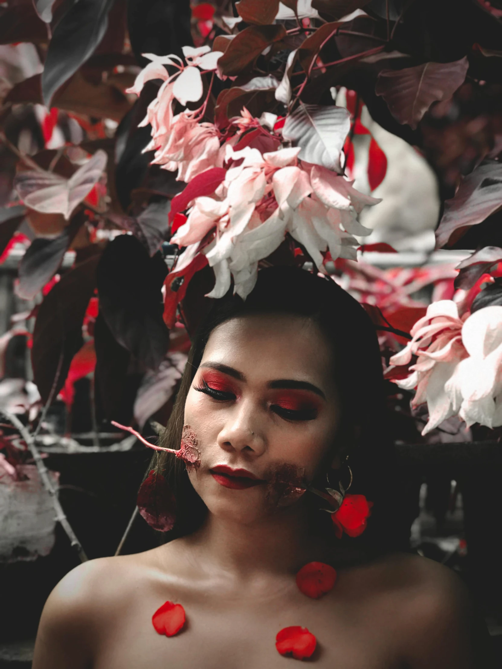 a woman with red flowers on her head, inspired by Elsa Bleda, pexels contest winner, portrait of modern darna, red white and black color scheme, made of leaves, snapchat photo