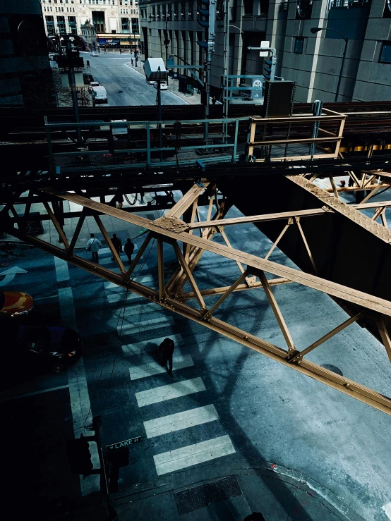 a man riding a skateboard on top of a wooden bridge, inspired by Thomas Struth, photorealism, construction equipment 1 9 9 0, overhead canopy, cinestill eastmancolor, in a factory