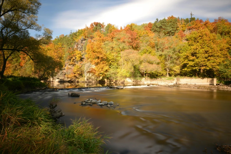 a river running through a lush green forest, a picture, pexels contest winner, hudson river school, maple trees with fall foliage, minn, thumbnail, slide show