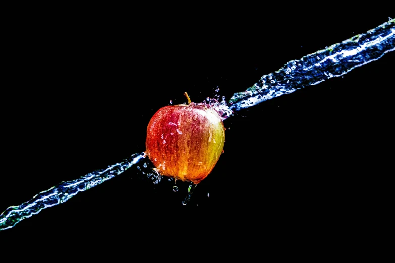 an apple is sprinkled with water on a black background, an album cover, by Jan Rustem, pexels, ilustration, 4 k hd wallpapear, unbeatable quality, ultra definition