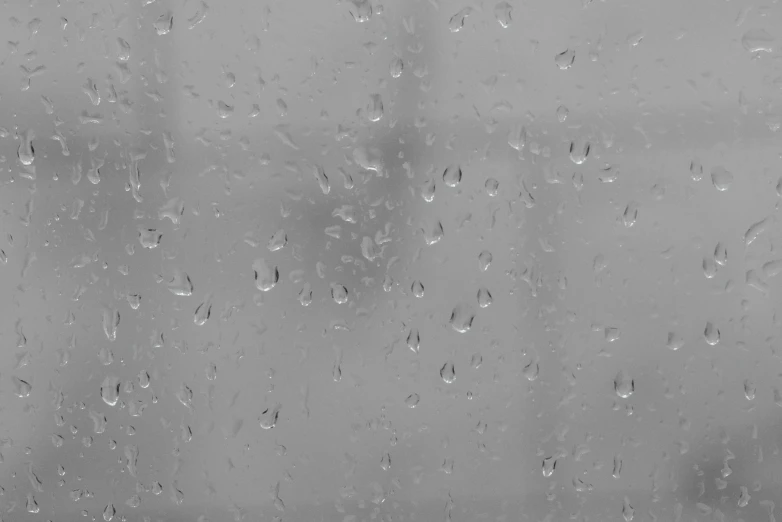 a black and white photo of rain on a window, a picture, pexels, minimalism, background image, diffuse outline, uploaded, solid gray