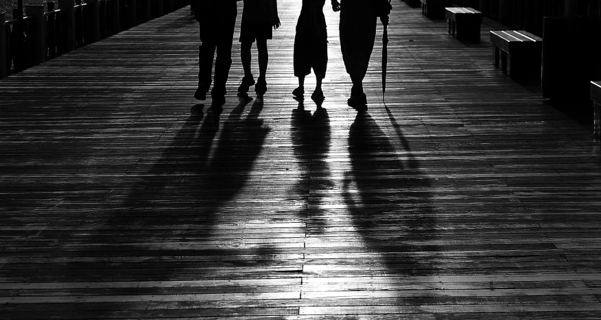 a group of people walking down a wooden walkway, by Joze Ciuha, mystical shadows, trio, maxim shirkov, four