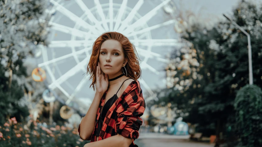 a woman standing in front of a ferris wheel, by Julia Pishtar, pexels contest winner, hyperrealism, reddish hair, holiday vibe, flannel, anna nikonova aka newmilky