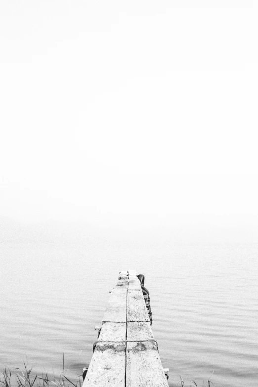 a black and white photo of a pier, inspired by Pierre Pellegrini, unsplash, minimalism, 2 5 6 x 2 5 6, small boat, simone graci, with a white background