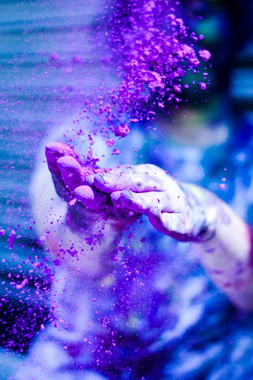 a person throwing colored powder into the air, inspired by Yves Klein, pexels contest winner, purple neon, grungy; colorful, made of liquid purple metal, white and purple