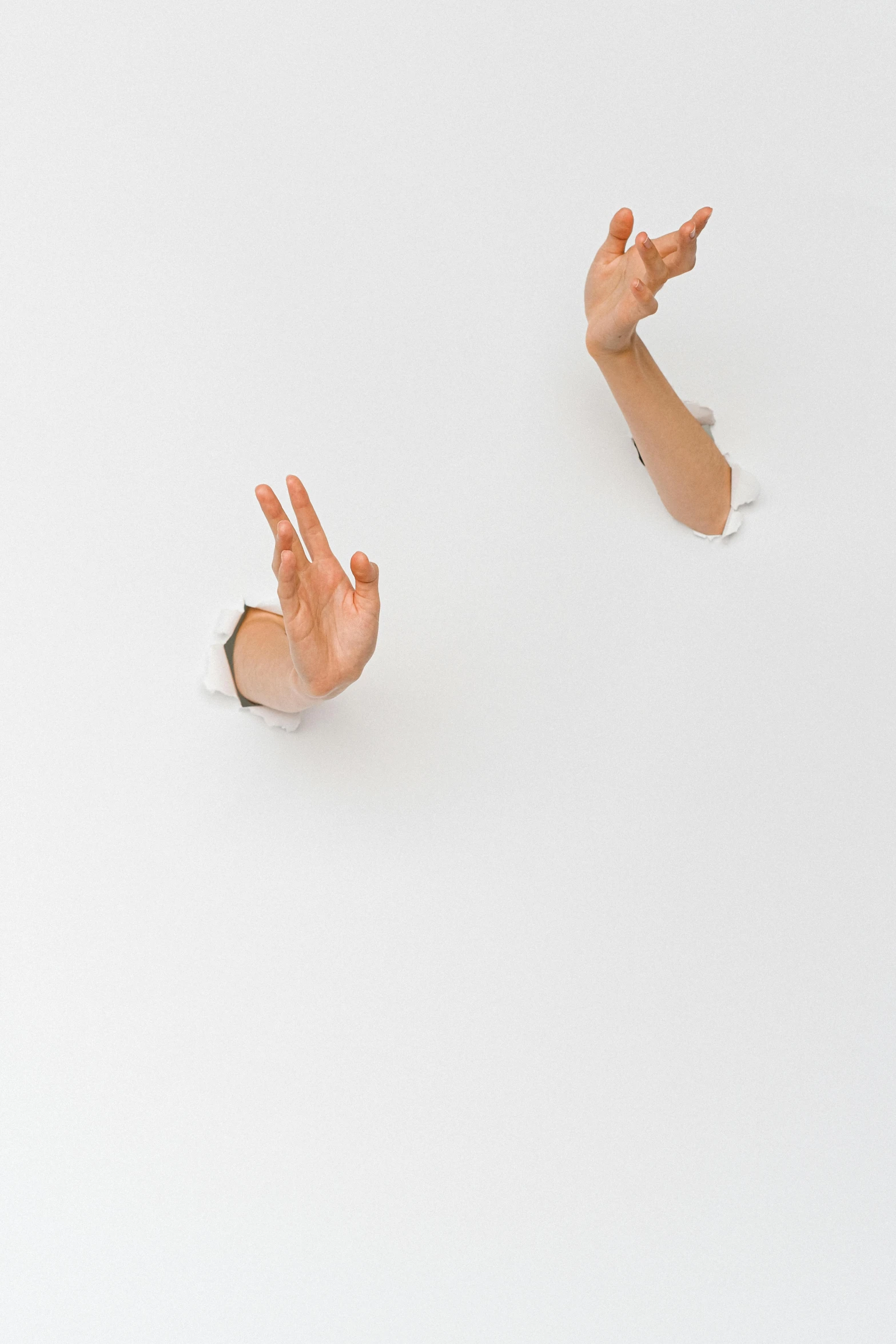 two hands reaching out of a hole in the ground, an album cover, inspired by Cornelia Parker, unsplash, conceptual art, white backdrop, floating objects, ignant, patricia piccinini