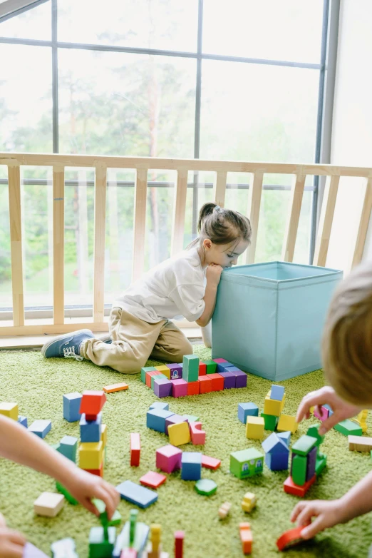 a group of children playing with blocks on the floor, with backdrop of natural light, 15081959 21121991 01012000 4k, square, pastel