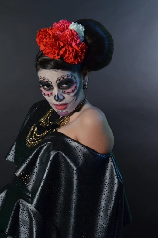 a woman in a black dress with a red flower in her hair, inspired by Francisco de Burgos Mantilla, skull face paint, production photo, square, ornately dressed