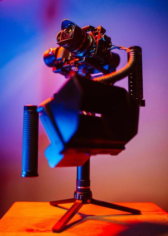 a close up of a camera on a tripod, a hologram, unsplash, video art, volumetric lighting. red, siggraph, high-quality photo, cinematic outfit photo