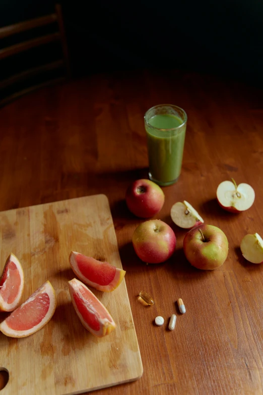 a cutting board sitting on top of a wooden table, a still life, by Morris Kestelman, juice, full frame image, jaime jasso, f / 2 0