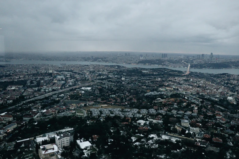 a view of a city from the top of a building, a picture, pexels contest winner, hurufiyya, overcast weather, view from helicopter, istanbul, slide show