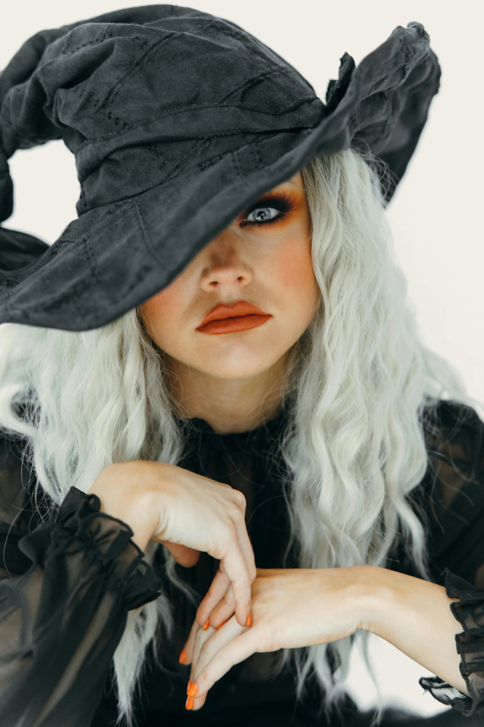 a woman with white hair wearing a black witch hat, trending on pexels, sydney sweeney, square, album, drow