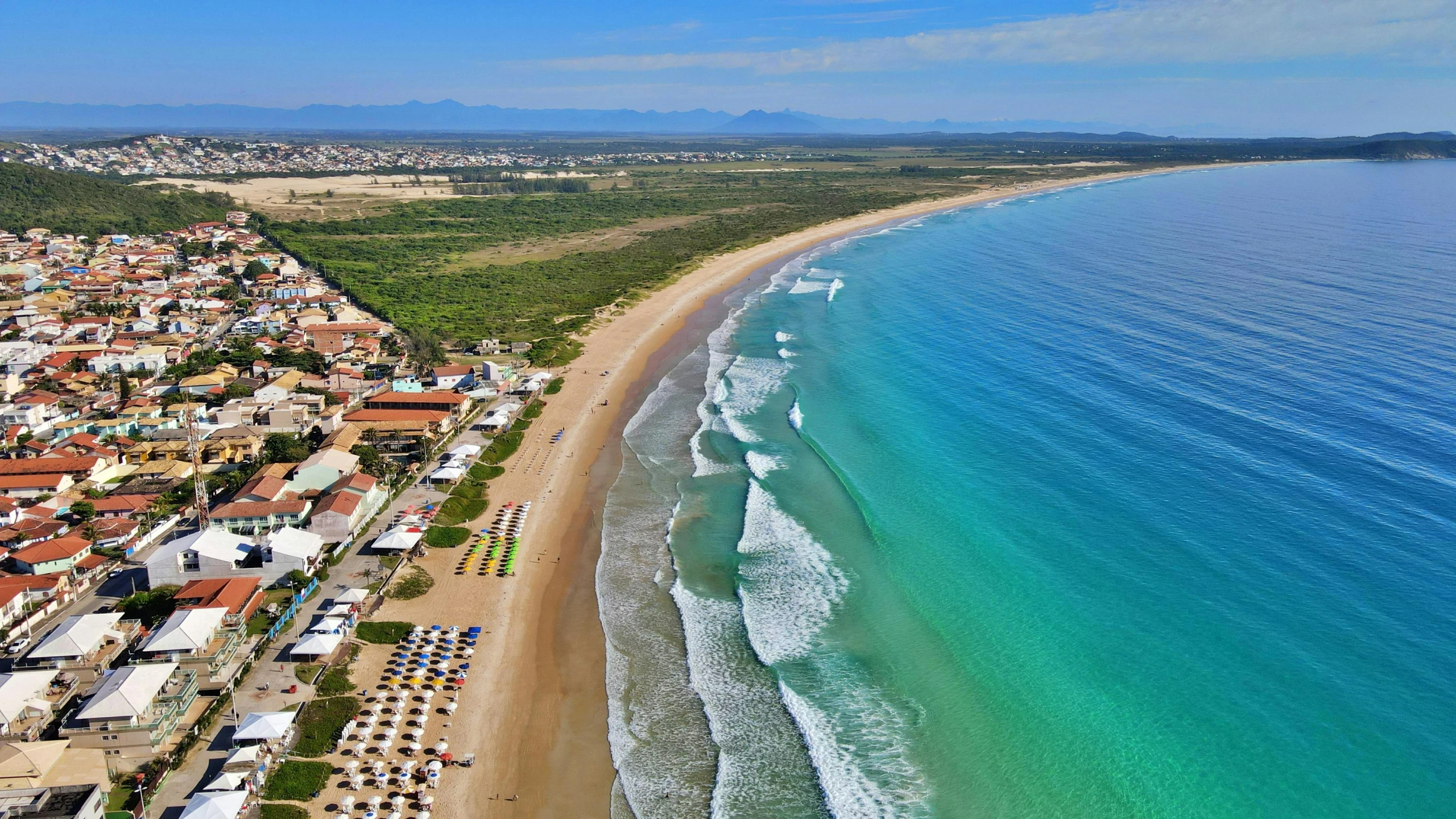 a large body of water next to a beach, by Luis Miranda, pexels contest winner, farol da barra, birdeye, monserrat gudiol, australian beach