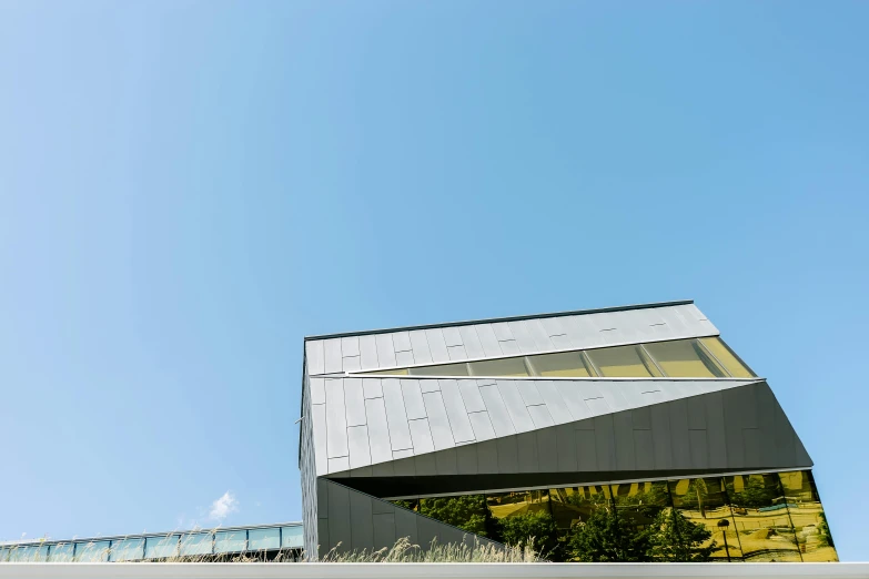 a man riding a skateboard up the side of a building, inspired by Tadao Ando, unsplash, brutalism, molten metal house, angular minimalism, cornell, exterior view