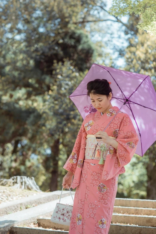 a woman in a pink kimono holding an umbrella, wētā fx, summer setting, shot with sony alpha, ethnicity : japanese