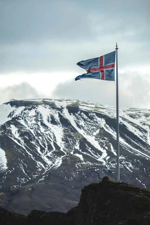 a flag flying in the wind on top of a mountain, inspired by Júlíana Sveinsdóttir, square, high-quality photo, reykjavik, banner