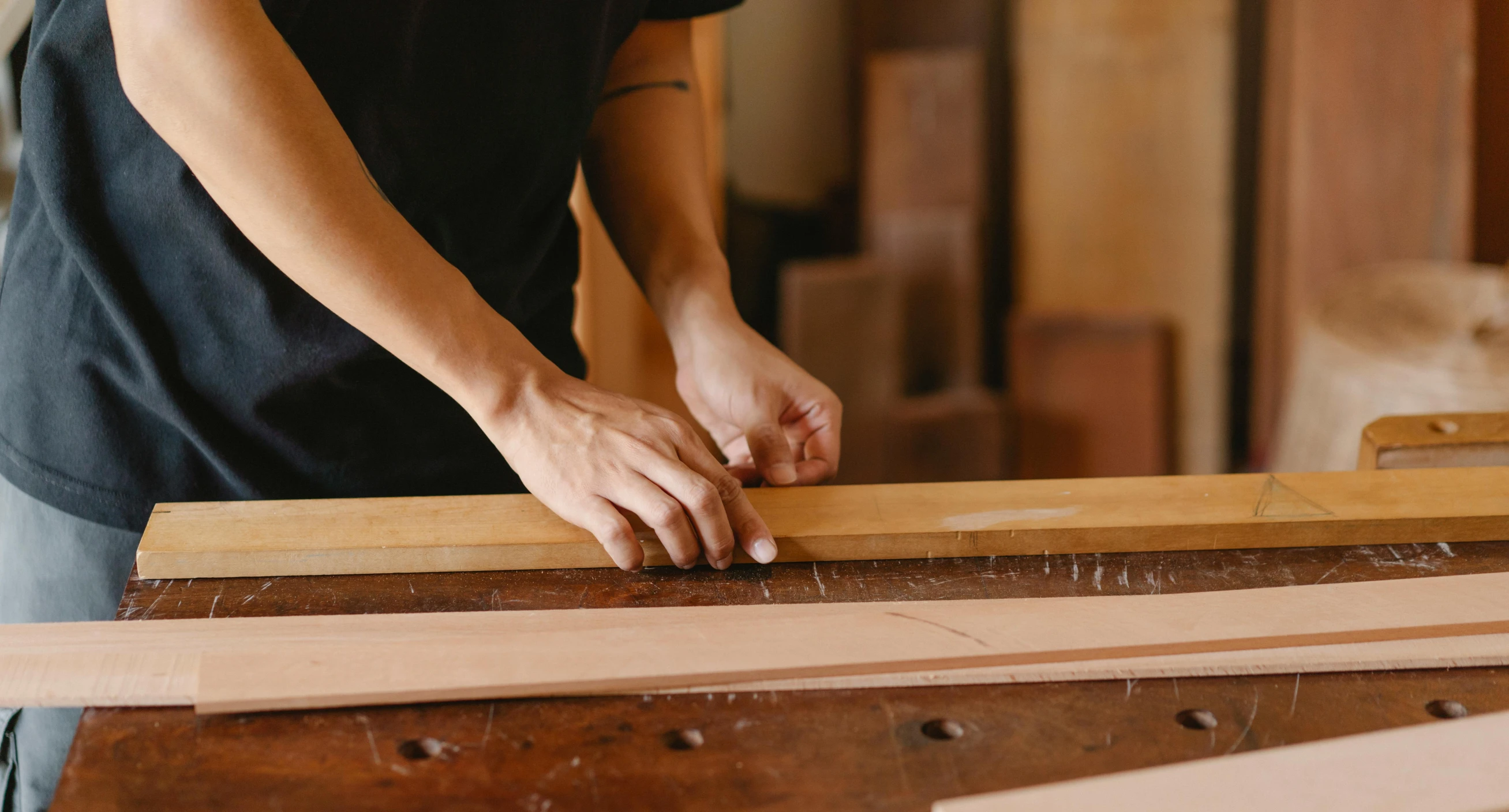 a person working on a piece of wood, trending on pexels, arts and crafts movement, nanae kawahara, rectangle, cedar, banner