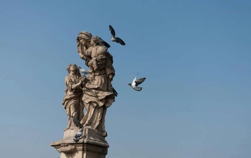 a statue with a bird flying over it, a statue, inspired by Giovanni Battista Tiepolo, pexels contest winner, three birds flying around it, parce sepulto, high vantage point, simone graci