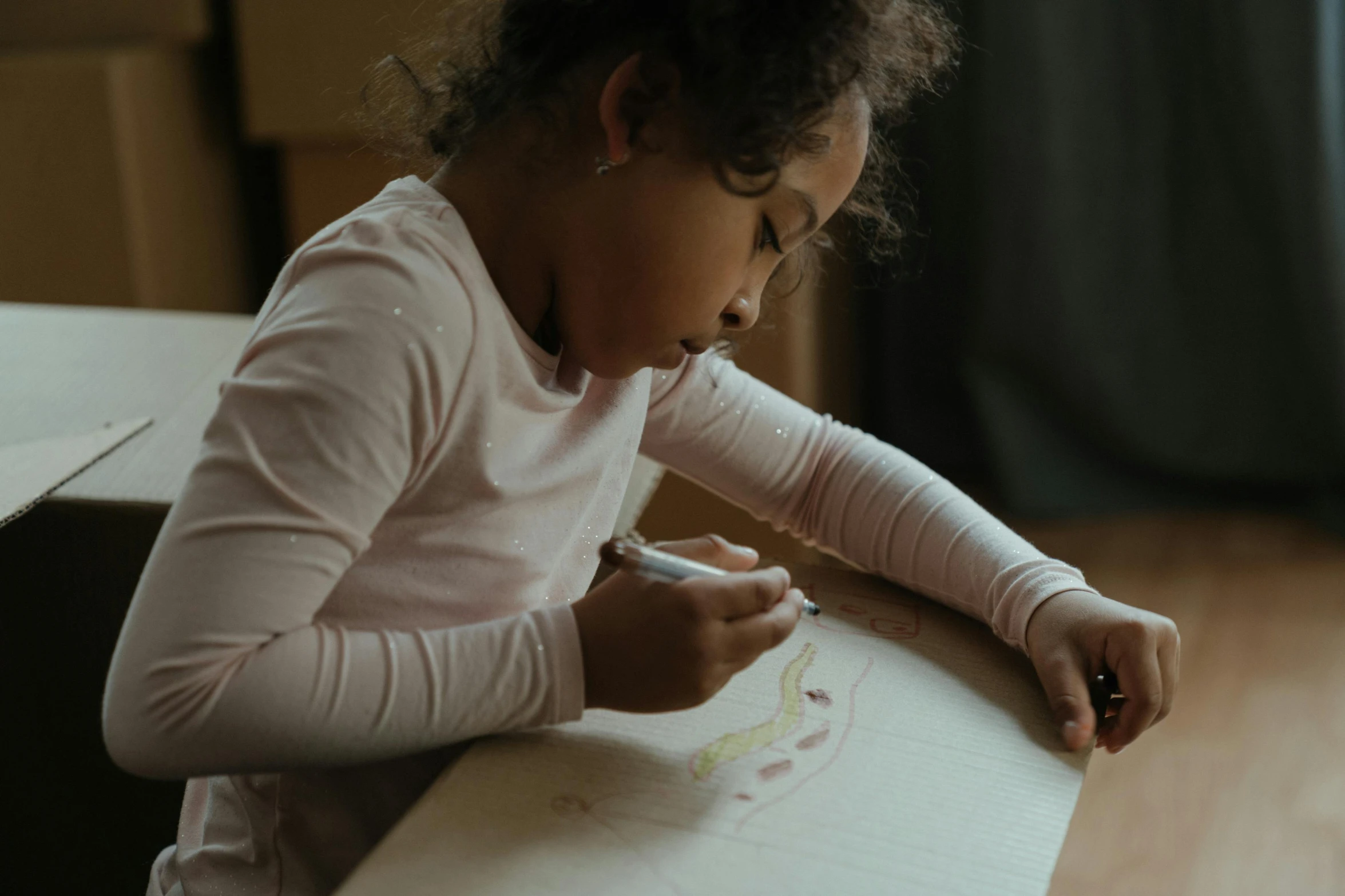 a little girl sitting at a table drawing on a piece of paper, pexels contest winner, youthful taliyah, painting on canvas, ashy, gif