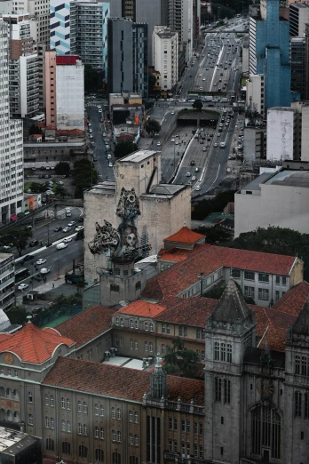 a view of a city from the top of a building, inspired by Francis Souza, hyperrealism, monument, parce sepulto, looking partly to the left, taken in the late 2010s