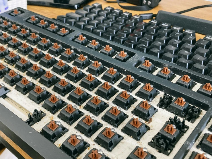 a computer keyboard sitting on top of a wooden desk, reddit, many rusty joints, thumbnail, r / paintedminis, chocolate