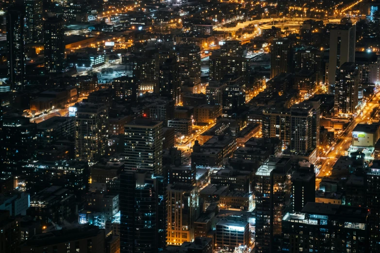 an aerial view of a city at night, pexels contest winner, chicago, stacked city, low detailed, night light